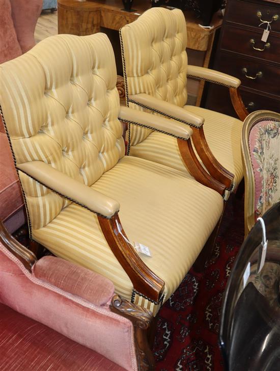 A pair of George III style Gainsborough armchairs,